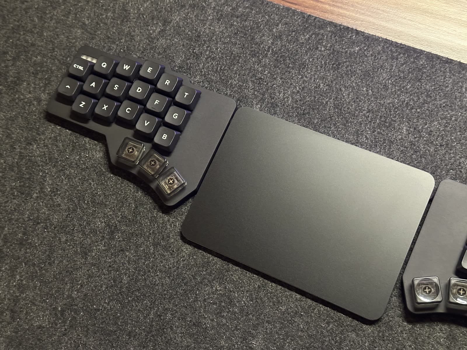 One keyboard half beside a trackpad